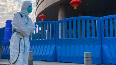 person dressed in pandemic hazard suit